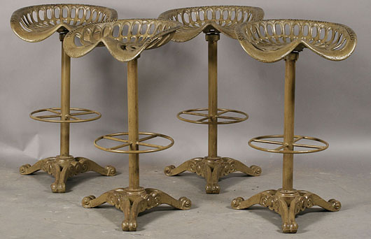  Ideal for a kitchen counter, four farm implement seat stools with cast-iron bases labeled “Baker Hamilton, San Francisco, Sacramento” sold for a hefty $3,690 in April. Image courtesy Kamelot Auctions, Philadelphia.